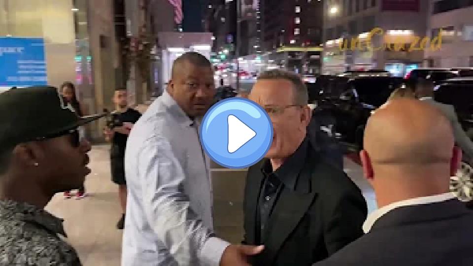 Play video: Tom Hanks becomes upset, pushes, and swears at fans after his wife Rita Wilson is nearly knocked over. Video thumb: Tom Hanks becomes upset, pushes, and swears at fans after his wife Rita Wilson is nearly knocked over.